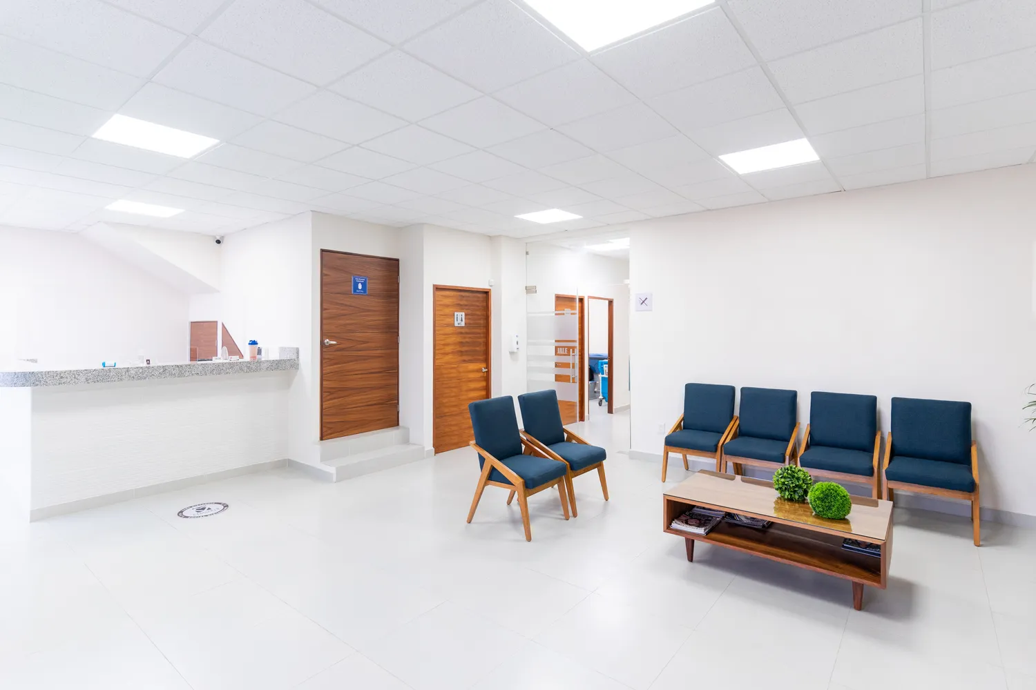 A bright, clean hospital waiting room with modern seating