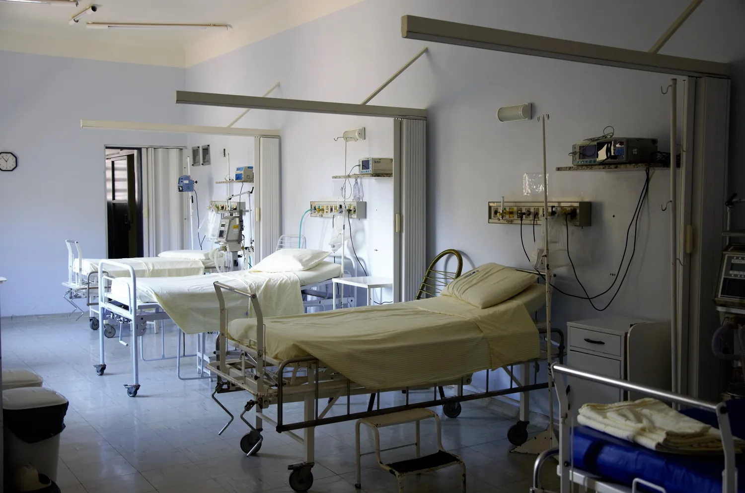 A spacious multi-bed hospital ward