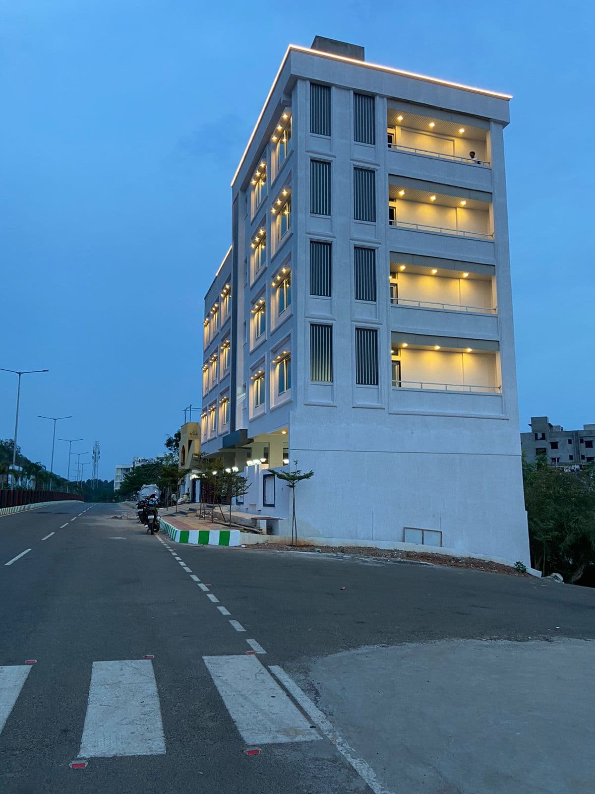 Aarogya building corner view with façade uplighting